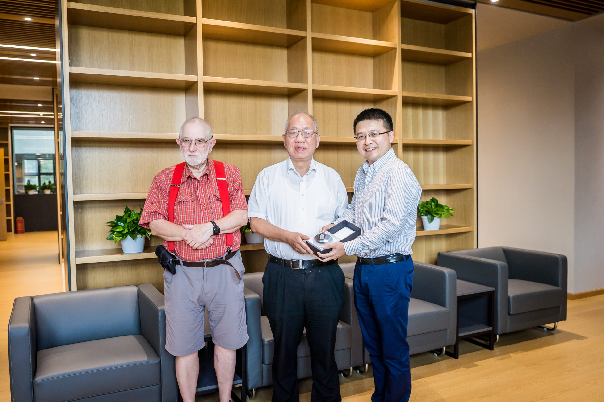 Sir Michael Berry (left), Shing-Tung Yau (center) and Wei Liu (right) with Gömböc 2023  in Beijing in 2023 at the Beijing Insitute of Mathematical Sceinces and Applications (BIMSA).